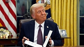 FILE - President Donald Trump signs executive orders in the Oval Office of the White House, 20 Jan. 2025, in Washington
