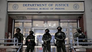 Federal law enforcement personnel stand watch outside the Metropolitan Detention Center as they await the arrival of captured Venezuelan President Nicolas Maduro, Jan. 3, 2026