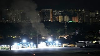 Smoke raises at La Carlota airport after explosions and low-flying aircraft were heard in Caracas, Venezuela, Saturday, Jan. 3, 2026.