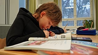 Ten-year-old fourth grade student Ilo Lindgren works during a media literacy class at Tapanila Primary School in Tapanila, Finland.
