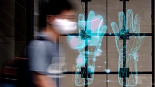 A man walks in Tokyo on July 21, 2020.