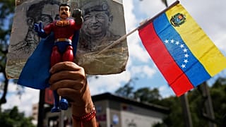 Government supporters burn a US flag after Trump announced that US forces had captured Venezuelan President Maduro and his wife, in Caracas, Venezuela, Saturday, Jan. 3, 2026