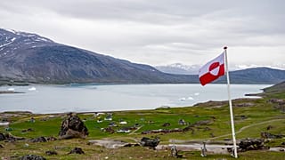 FILE: A view of a Greenland flag in the village of Igaliku in Greenland, 4 July 2025