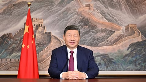 In this photo released by Xinhua News Agency, Chinese President Xi Jinping delivers his 2026 New Year message in Beijing on Wednesday, Dec. 31, 2025