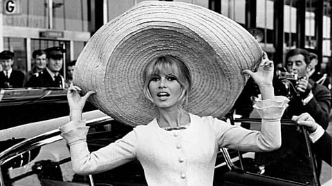 FILE: Brigitte Bardot poses with a huge sombrero after her return to Paris from Mexico, May 1965