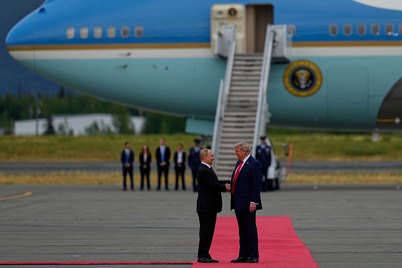 President Donald Trump greets Russia's President Vladimir Putin Friday, Aug. 15, 2025, at Joint Base Elmendorf-Richardson, Alaska.