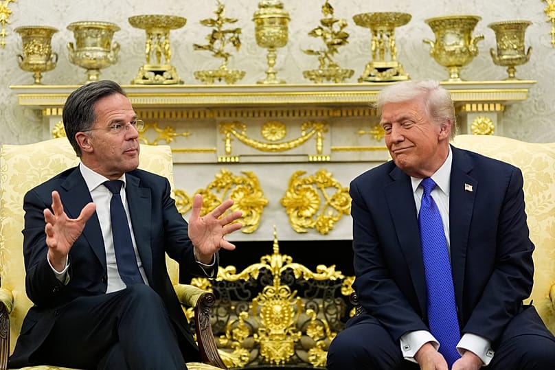 FILE: US President Donald Trump speaks with NATO Secretary General Mark Rutte at the White House in Washington, 13 March 2025