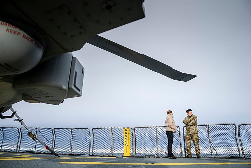 Denmark's Prime Minister Mette Frederiksen speaks with the head of the Arctic Command, Soeren Andersen, in the waters around Nuuk, 3 April 2025