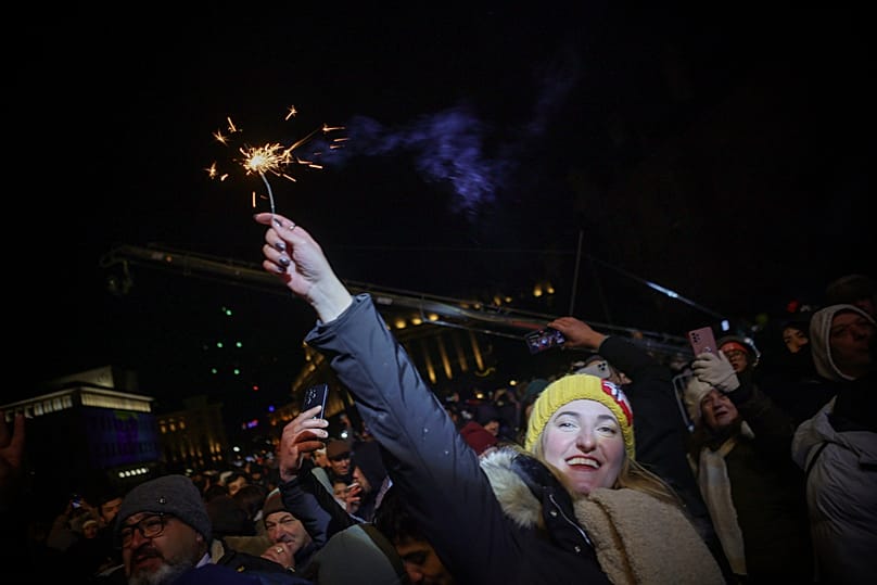 A woman holds sparklers during the celebration of the New Year and Bulgaria's adoption of the euro in Sofia, 31 December 2025